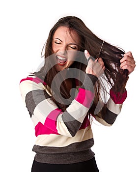 Woman is combing her hair