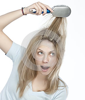 Woman combing her hair