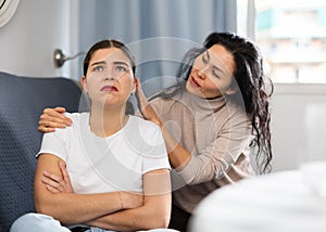 Woman comforting her depressed female friend