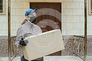 Woman Coming Back To Home Delivery In Cardboard Box Outside Front Door