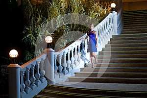 Woman coming downstairs photo