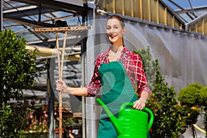 Woman commercial gardener in nursery