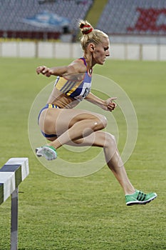 Woman competitor at 3000m steeplechase