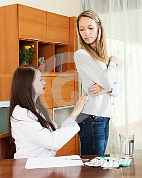 Woman complaining of pain in behind