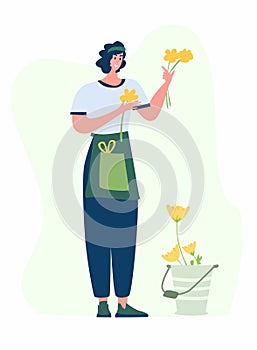 Woman compose bouquet on table. Forist shop or store.