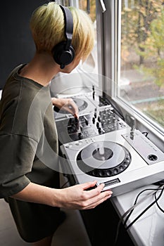 Woman composing music at home