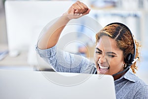 Woman, computer and fist pump for win, call center and bonus or yes, emoji and corporate success. Telemarketing agent