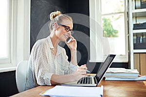 Woman, computer and happy in home office with phone call for business networking, remote communication and multitasking