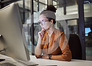 Woman, computer and office with glasses show reflection on face while working overtime. Girl, thinking and idea read