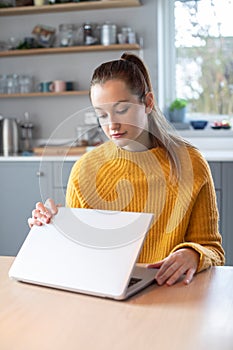 Woman Concerned About Excessive Use Of Internet Closing Lid Of Laptop Computer