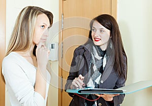 Woman conducting survey among residents