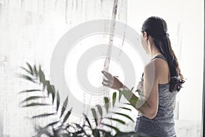 Woman in confinement observing daylight