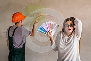 Woman confused by the colour of the wall