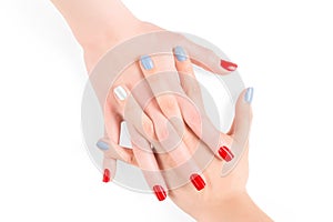 Woman connected hands with red and blue shellac nail polish