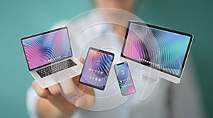 Woman connecting modern smartphone tablet laptop and computer 3D rendering