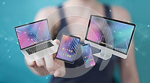 Woman connecting modern smartphone tablet laptop and computer 3D rendering