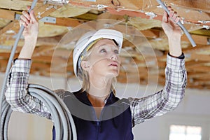 woman connecting network cables to switches