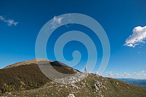 Woman conquest the peak of mountain