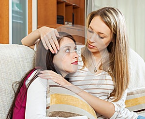 Woman consoling the depressed girl