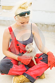 Woman on constriction site with dog