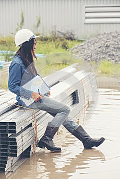 Woman construction engineer wear safety white hard hat at construction site industry worker. Female engineer worker civil