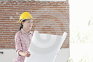 Woman construction engineer wear safety white hard hat at construction site industry worker. Female engineer worker civil