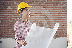 Woman construction engineer wear safety white hard hat at construction site industry worker. Female engineer worker civil