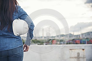 Woman construction engineer wear safety white hard hat at construction site industry worker. Female engineer worker civil