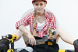 Woman constructive worker with tool bag