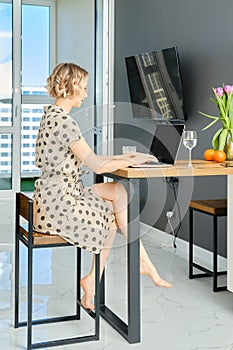 Woman contacting client by conference, talking on webcam, online consultation
