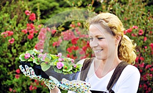 Woman with container-grown plants