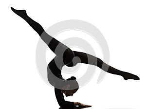 Woman contortionist exercising gymnastic yoga silhouette