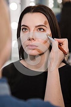 Woman during contouring procedure