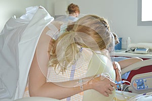 Woman during contractions on a fitness ball Parturition