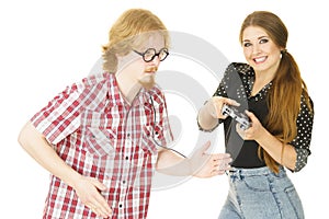 Woman controling man using gaming pad