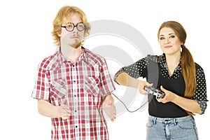 Woman controling man using gaming pad