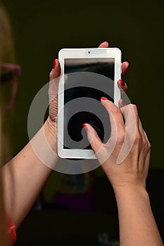 Mobile tablet in female hands photo