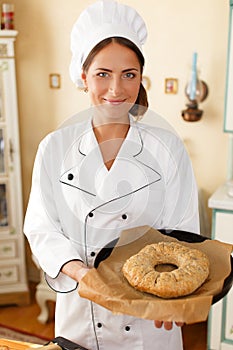 Woman cook with baked goods