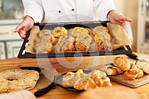 Woman cook with baked goods photo