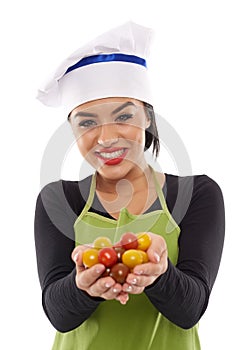 Woman cook with a bunch of cherry tomatoes
