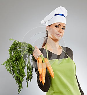 Woman cook with carrots