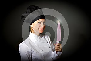 Woman cook chef with kitchen knife