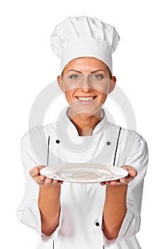 Woman cook or chef serving empty plate and smiling happy