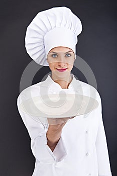 Woman cook or chef serving empty plate