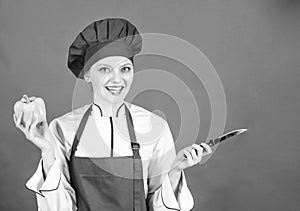 Woman in cook hat and apron. professional chef in kitchen. Cuisine. sweet pepper. happy woman cooking healthy food by