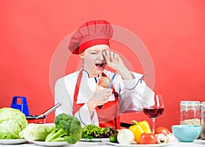 Woman in cook hat crying because of onion. professional chef on red background. organic eating and vegetarian. Housewife