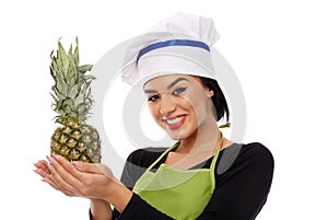 Woman cook offering pineapple