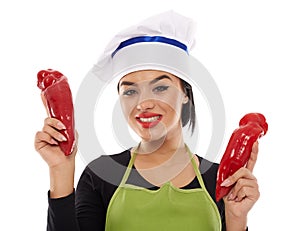 Woman cook with red peppers