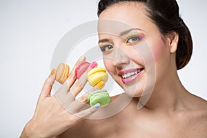 Woman with cookies makarons