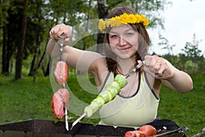 Woman cooking on brazier